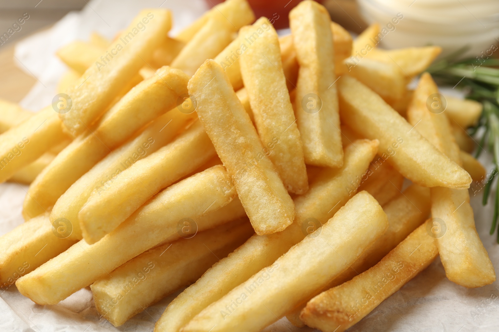 Fresh tasty french fries on table, closeup Photo of Fresh tasty french fries on table, closeup