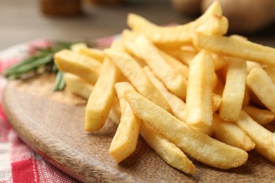Photo of Fresh tasty french fries on table, closeup