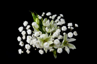 Photo of Woman holding bouquet with beautiful gypsophila and freesia on black background, closeup