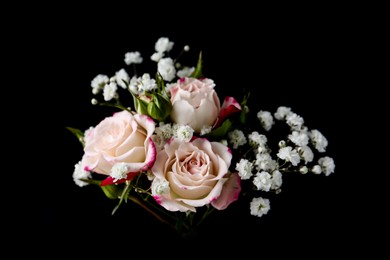 Photo of Woman holding bouquet with beautiful gypsophila and roses on black background, closeup