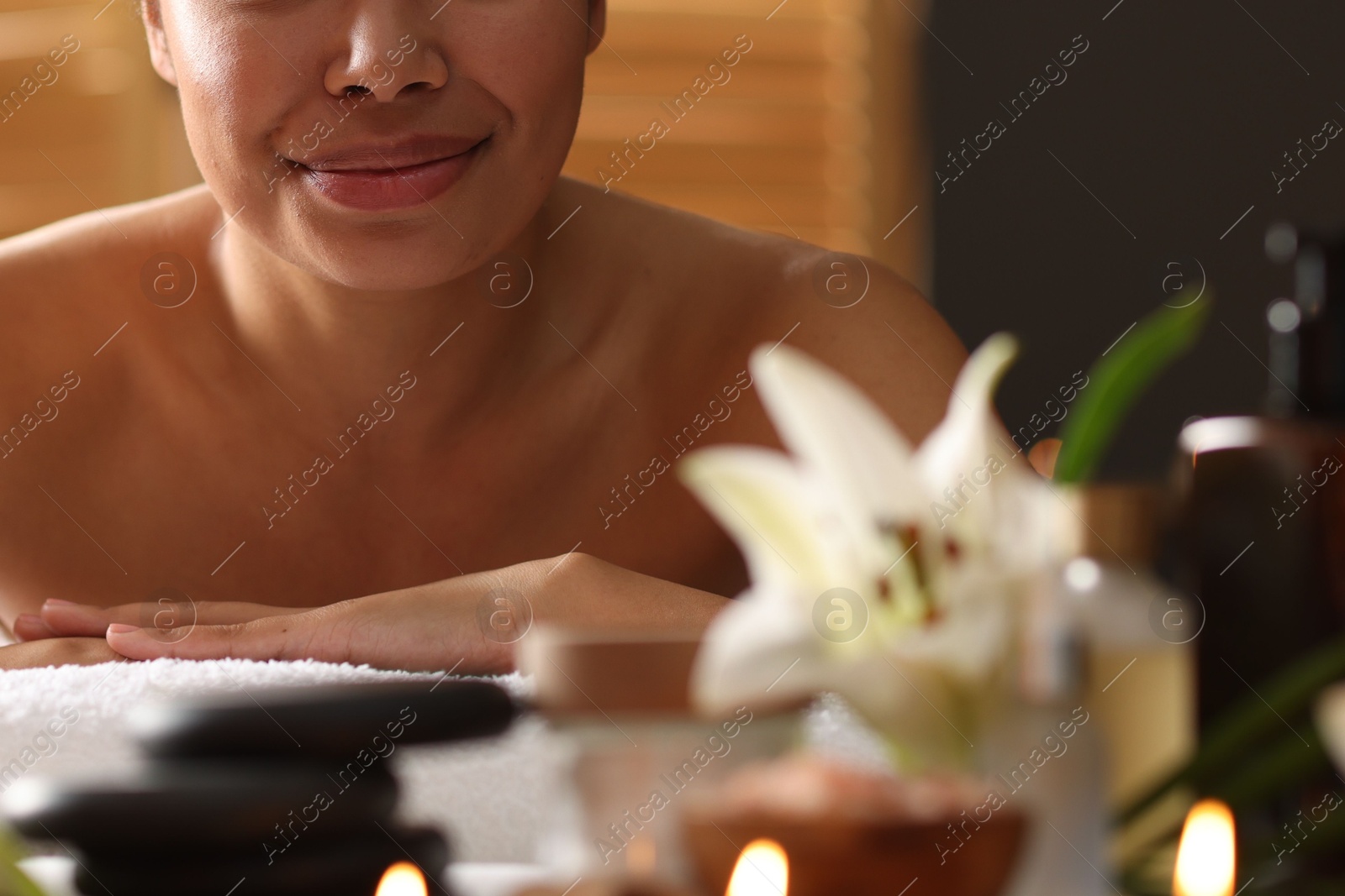 Woman relaxing on massage couch in spa salon, closeup Photo of Woman relaxing on massage couch in spa salon, closeup