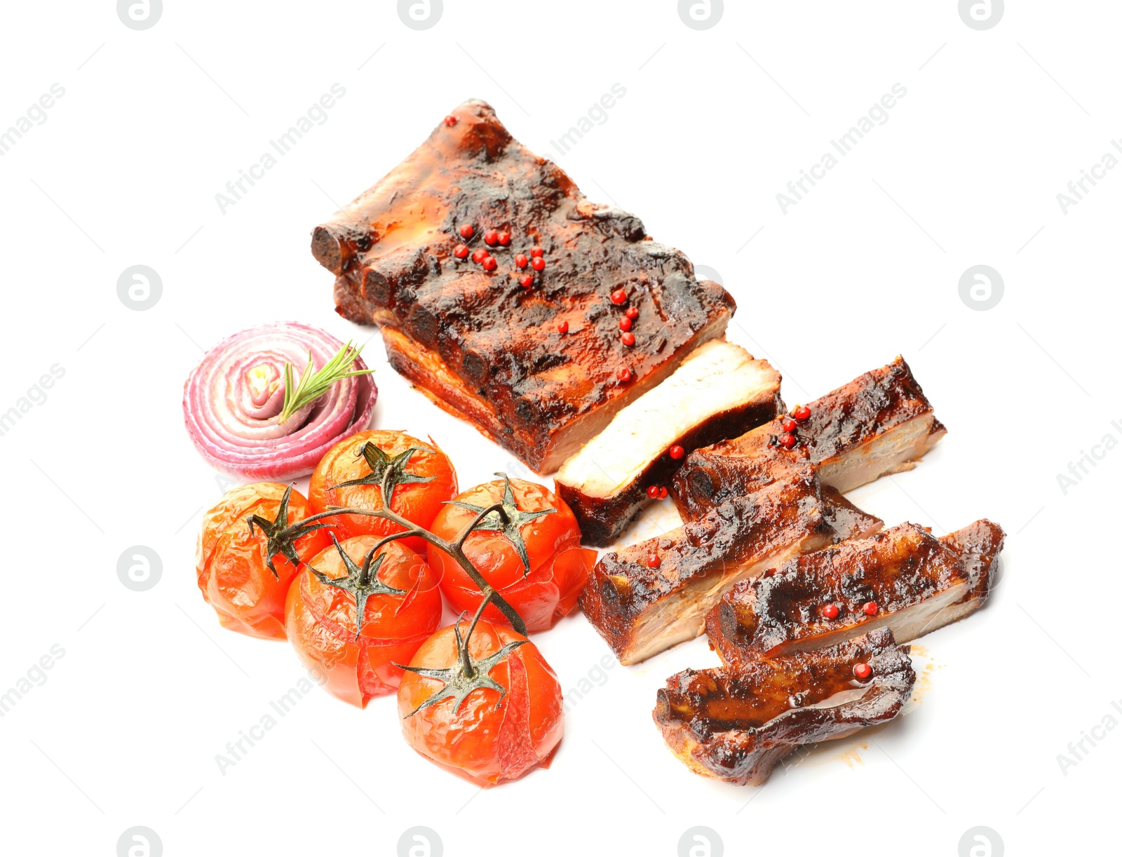Delicious roasted pork ribs with tomatoes and onion isolated on white Photo of Delicious roasted pork ribs with tomatoes and onion isolated on white