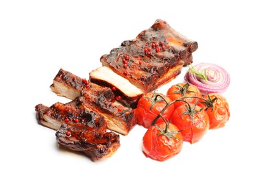 Photo of Delicious roasted pork ribs with tomatoes and onion isolated on white