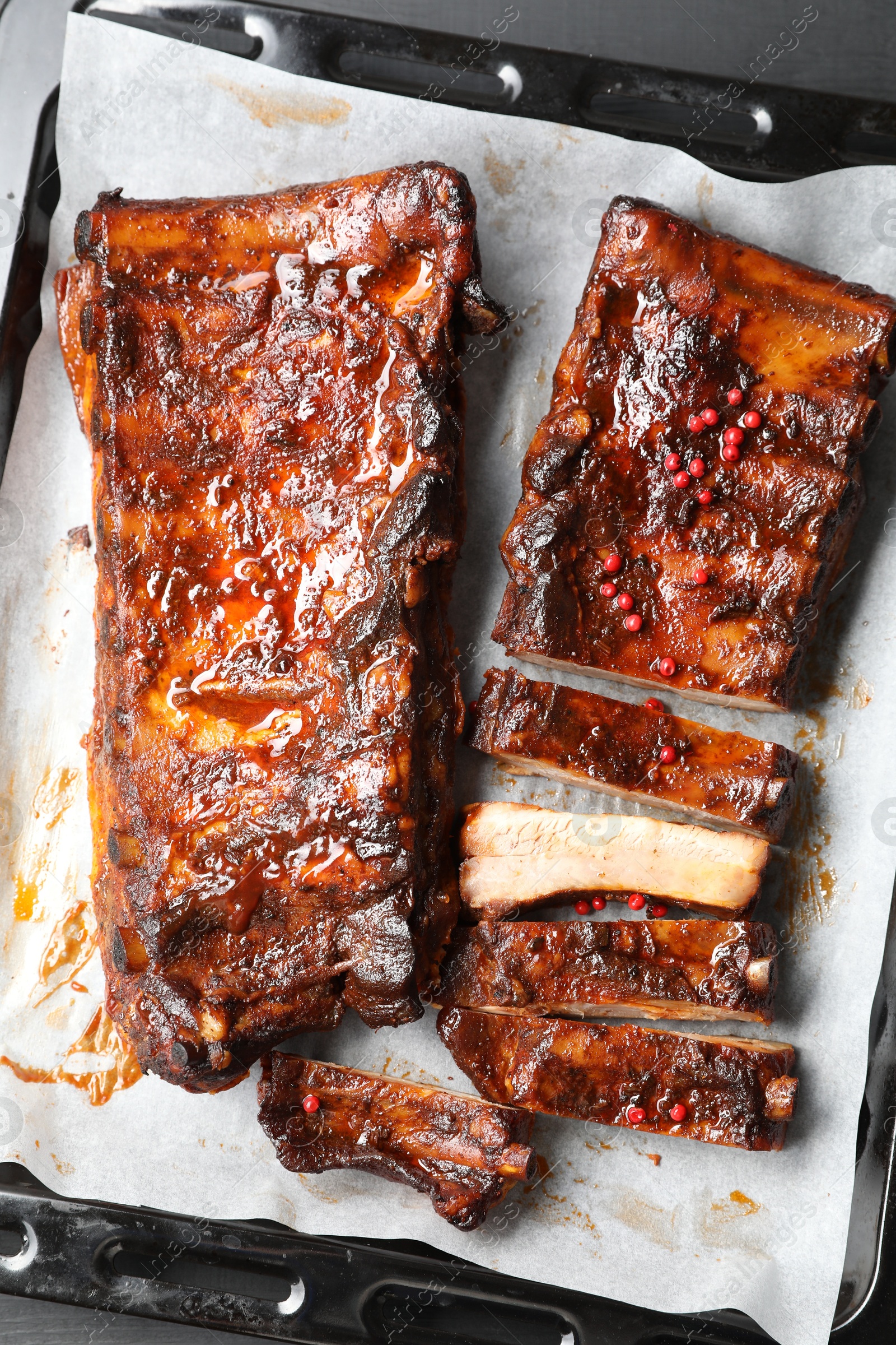 Delicious spare ribs on grey table, top view Photo of Delicious spare ribs on grey table, top view