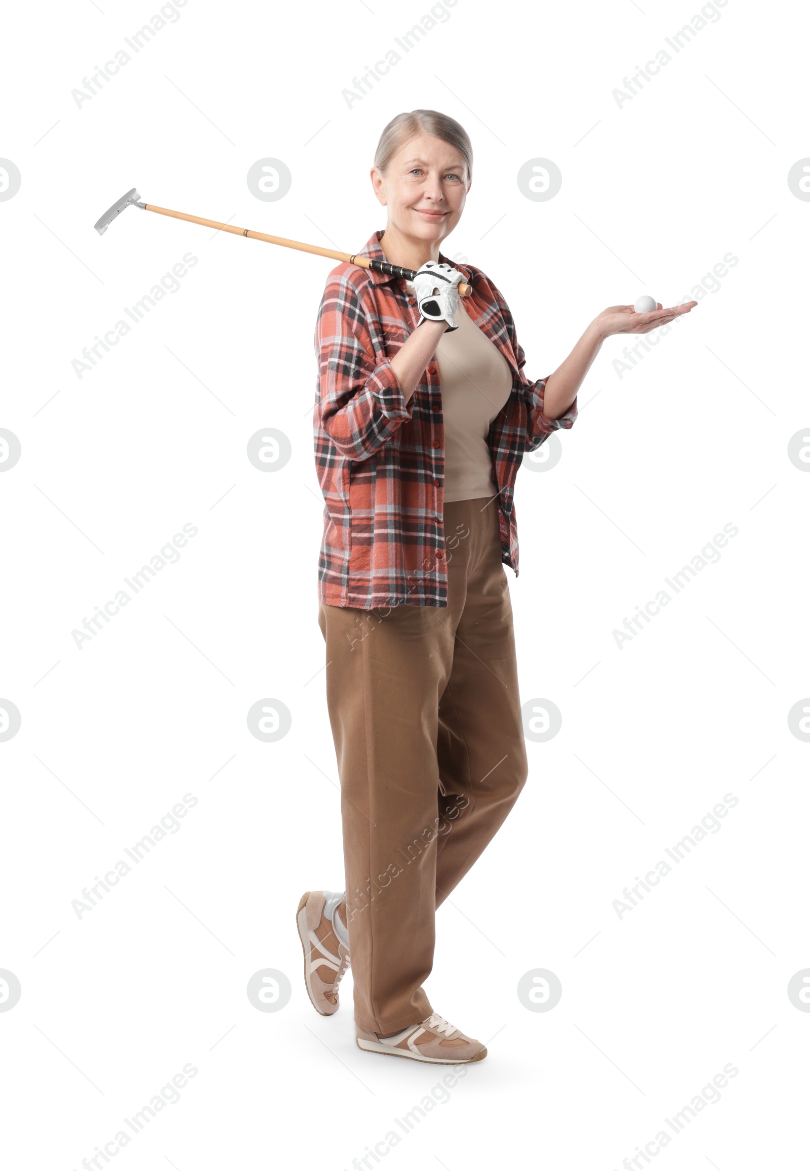 Senior woman with golf club and ball on white background Photo of Senior woman with golf club and ball on white background
