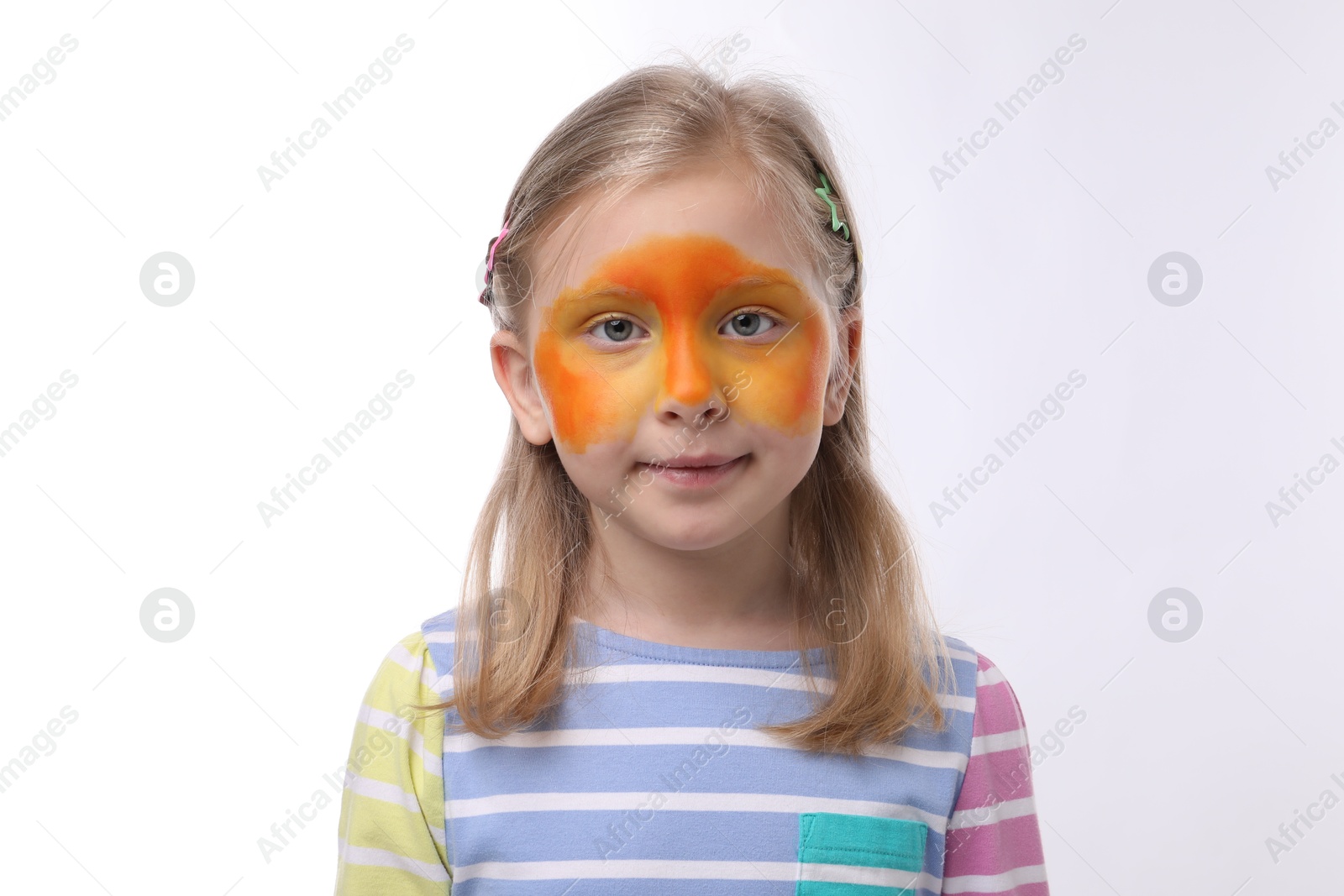Cute girl with orange face painting on white background Photo of Cute girl with orange face painting on white background