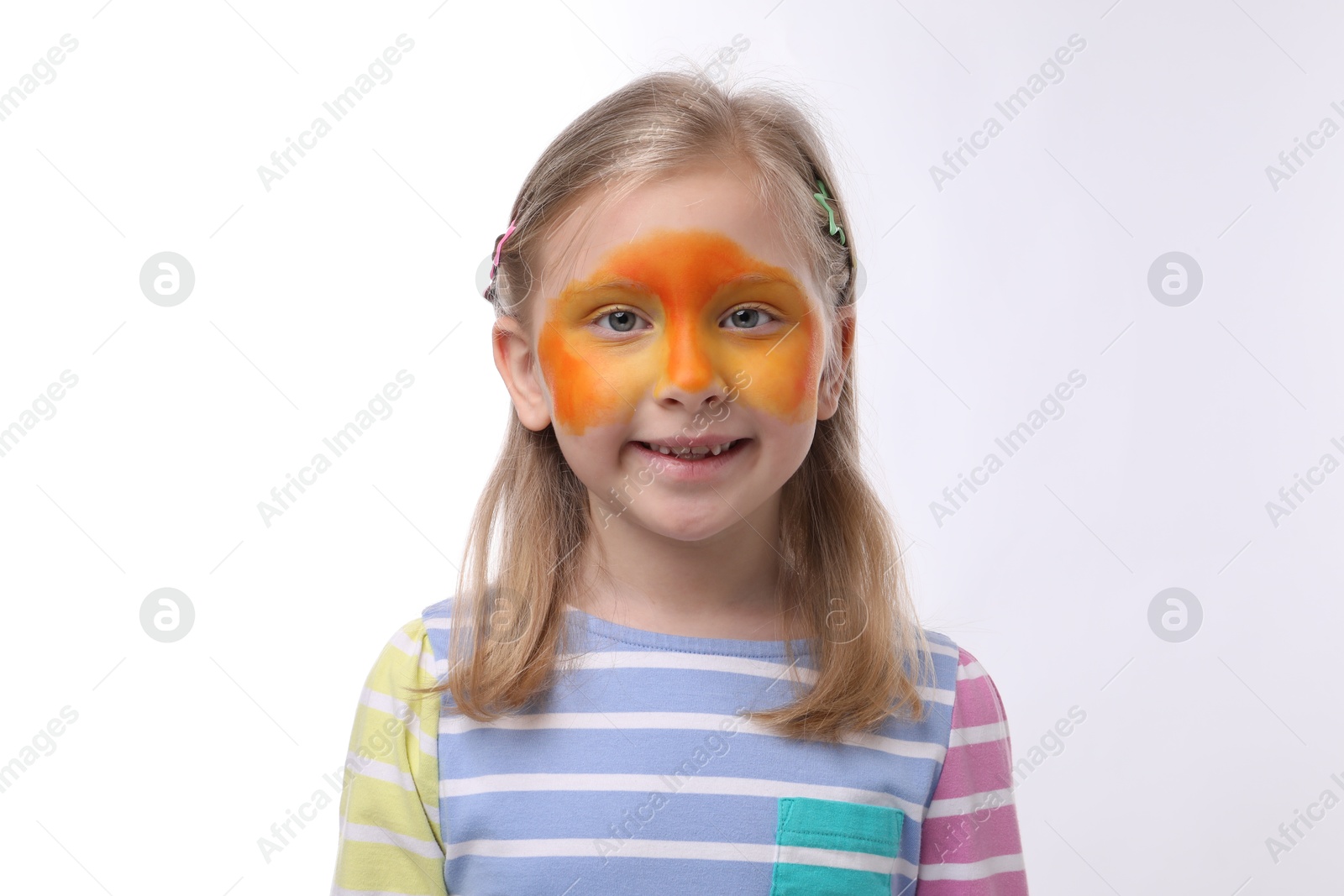 Cute girl with orange face painting on white background Photo of Cute girl with orange face painting on white background