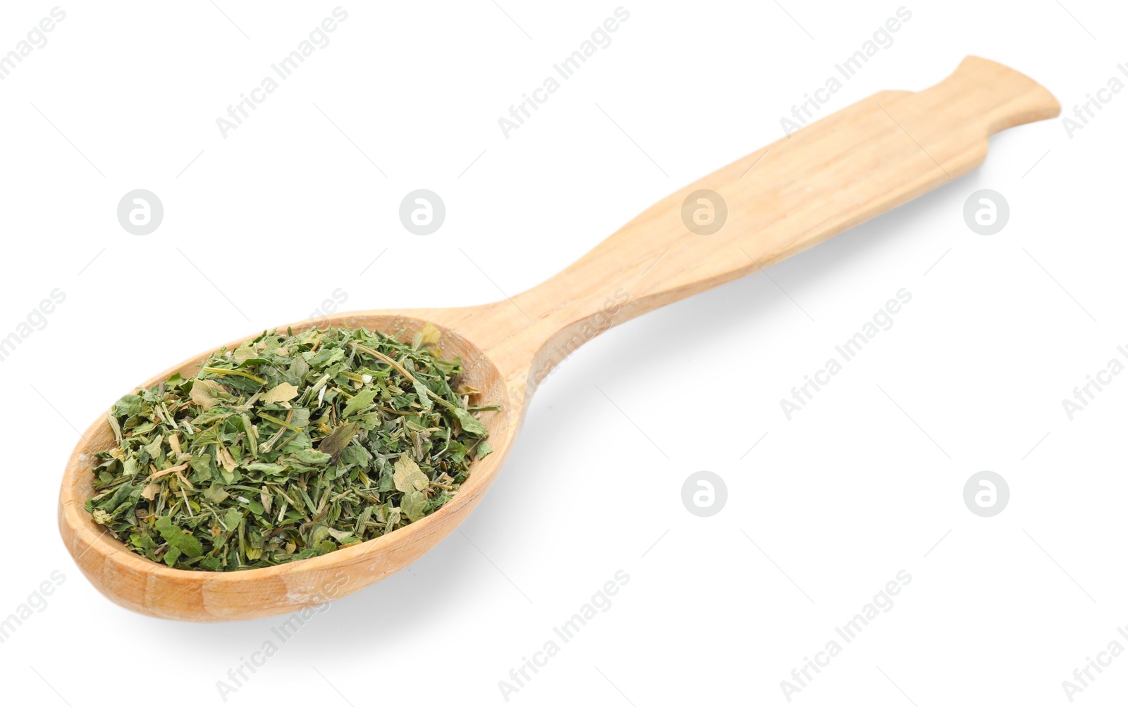Dried parsley in wooden spoon isolated on white Photo of Dried parsley in wooden spoon isolated on white