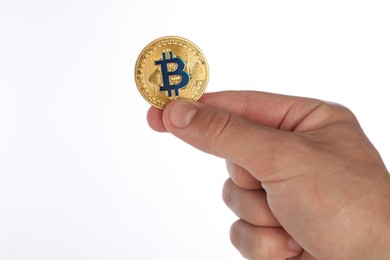 Photo of Cryptocurrency. Man holding bitcoin on white background, closeup