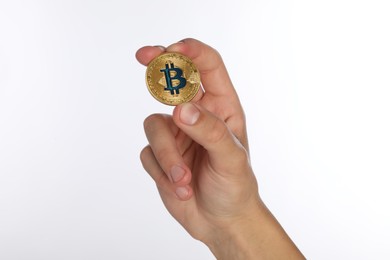 Photo of Cryptocurrency. Man holding bitcoin on white background, closeup