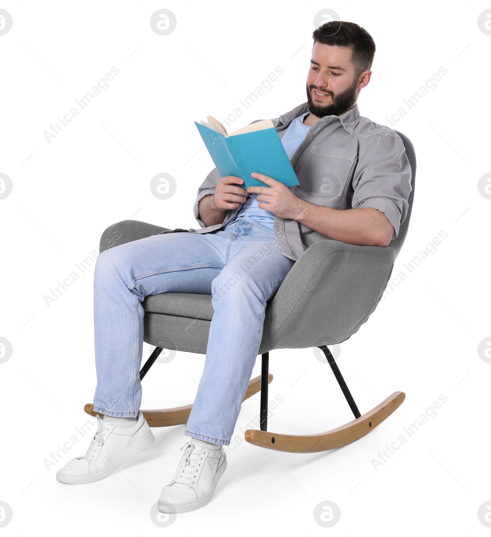 Smiling man relaxing with book in rocking chair on white background Photo of Smiling man relaxing with book in rocking chair on white background