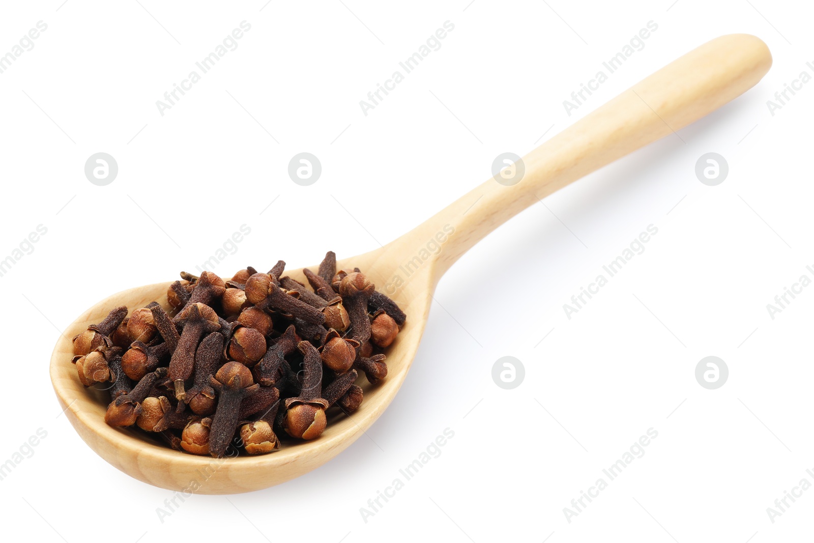 Aromatic cloves in wooden spoon isolated on white Photo of Aromatic cloves in wooden spoon isolated on white
