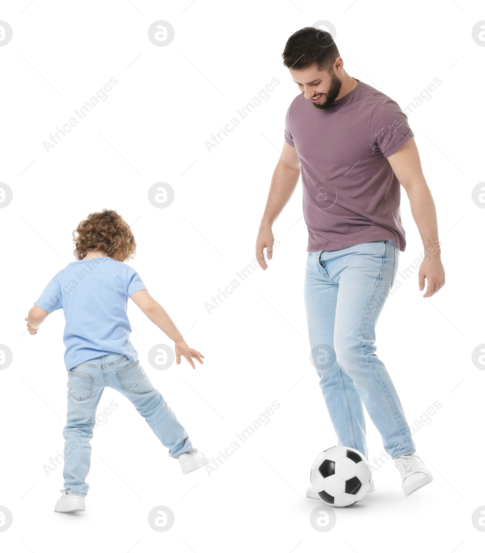 Happy father and his son playing football on white background Photo of Happy father and his son playing football on white background
