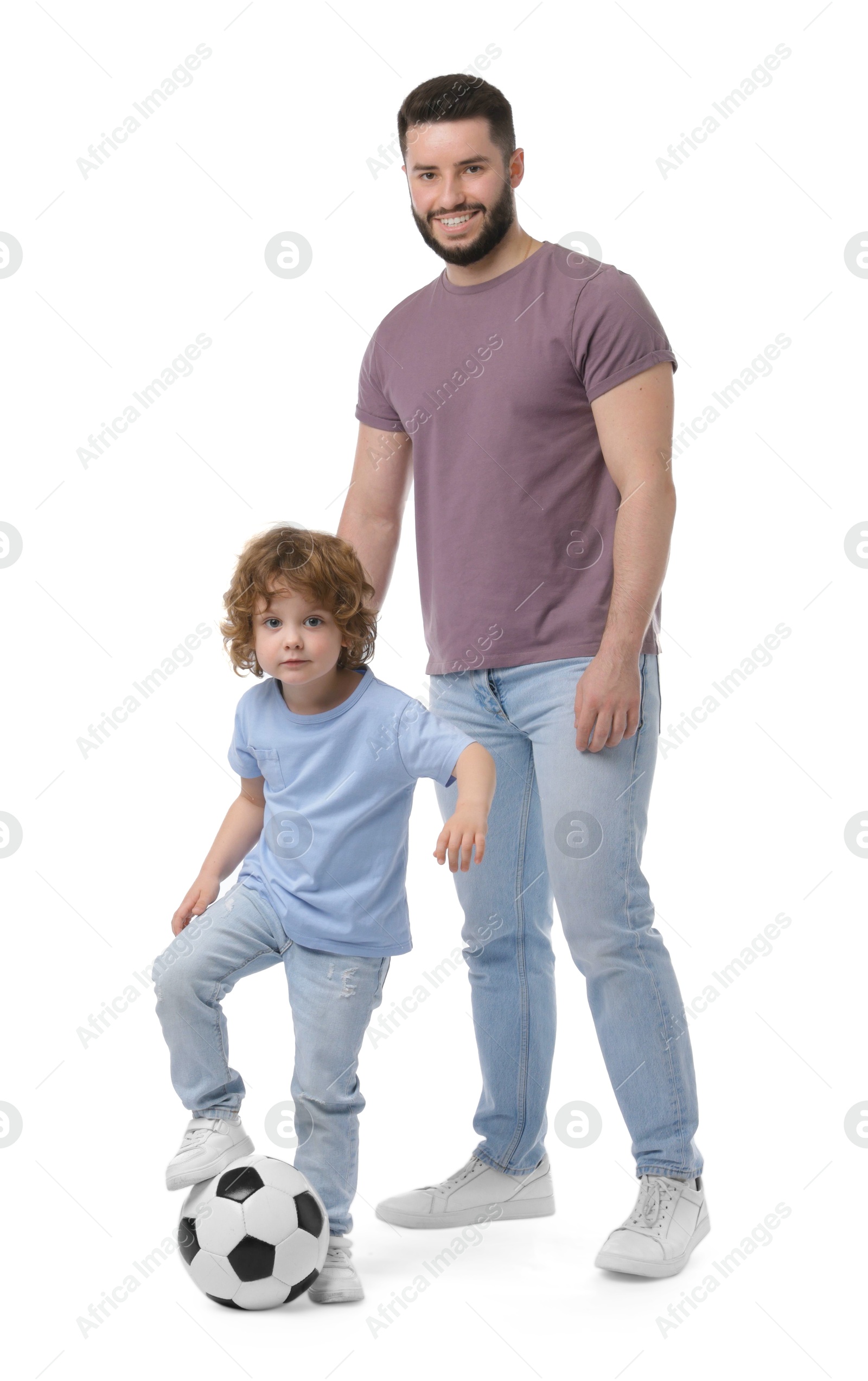 Happy father and his son playing football on white background Photo of Happy father and his son playing football on white background