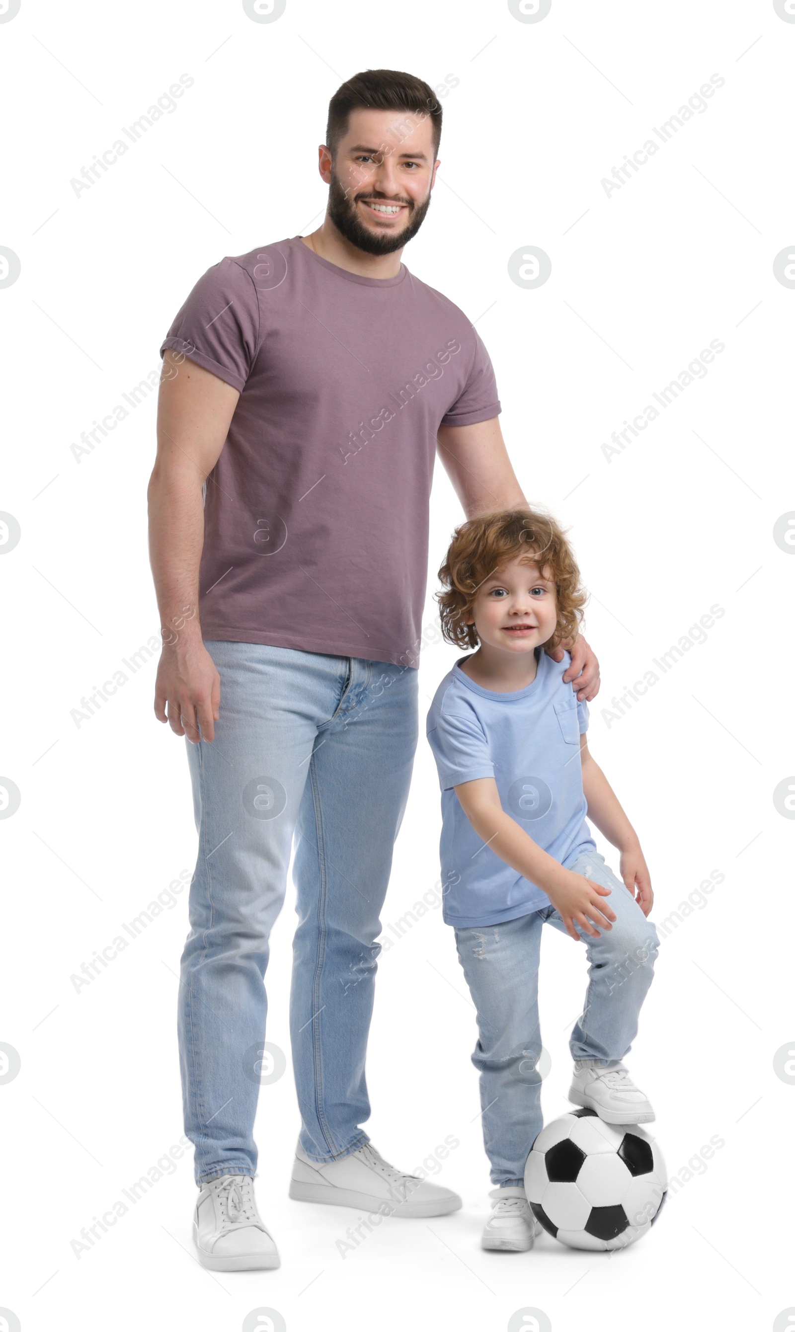 Happy father and his son playing football on white background Photo of Happy father and his son playing football on white background