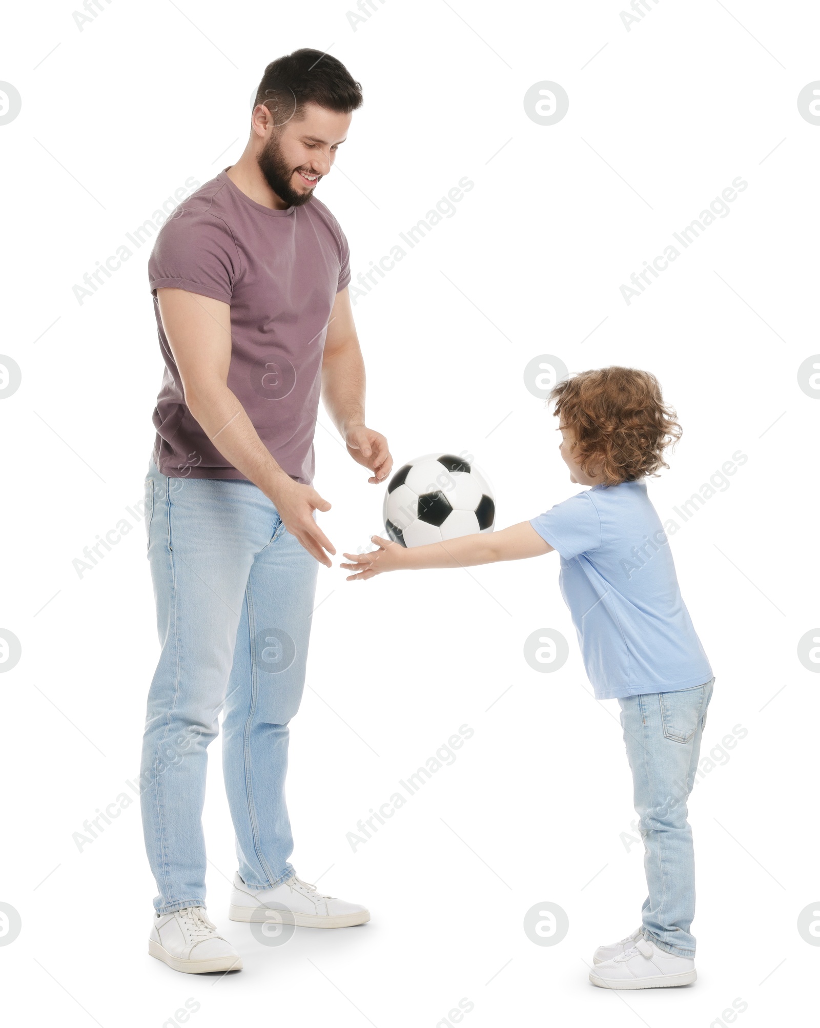 Happy father and his son playing football on white background Photo of Happy father and his son playing football on white background