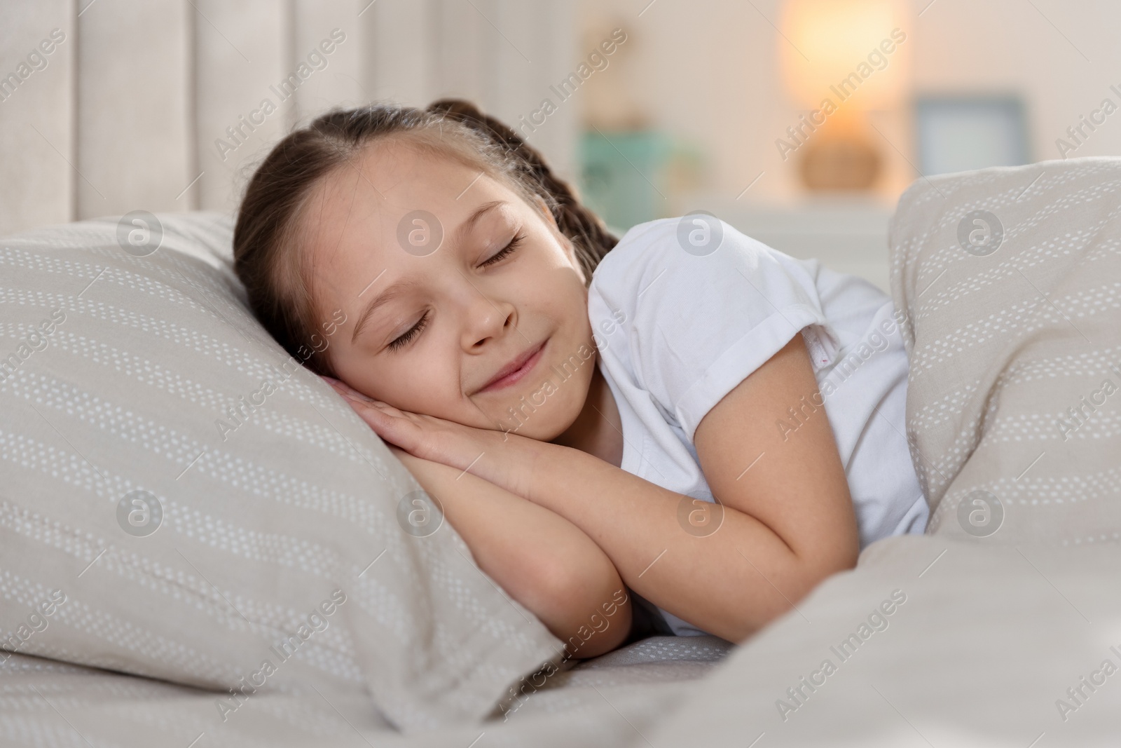 Cute girl sleeping in bed at home Photo of Cute girl sleeping in bed at home