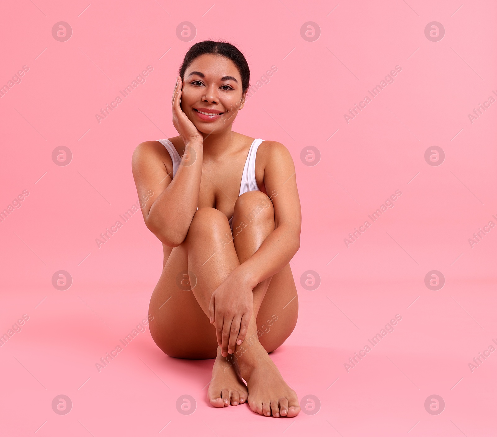 Photo of Woman in underwear with smooth skin after epilation procedure on pink background, space for text