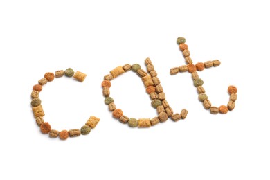 Photo of Word Cat made of dry pet food isolated on white, above view