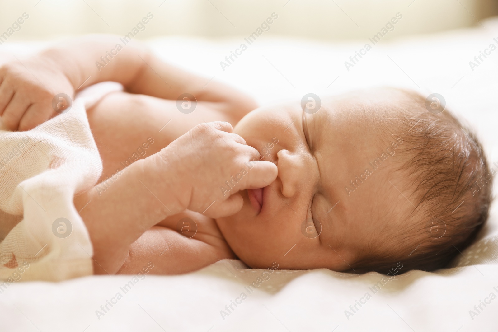 Bedtime. Cute little baby sleeping in bed indoors Photo of Bedtime. Cute little baby sleeping in bed indoors