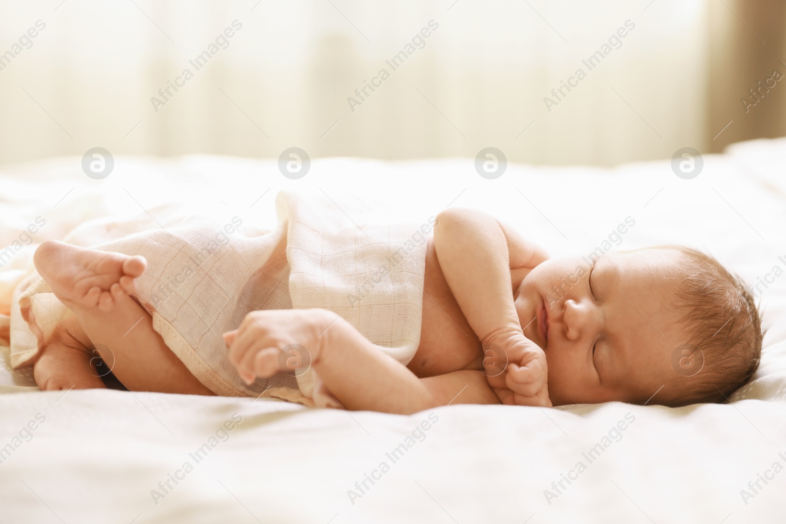 Bedtime. Cute little baby sleeping in bed indoors Photo of Bedtime. Cute little baby sleeping in bed indoors