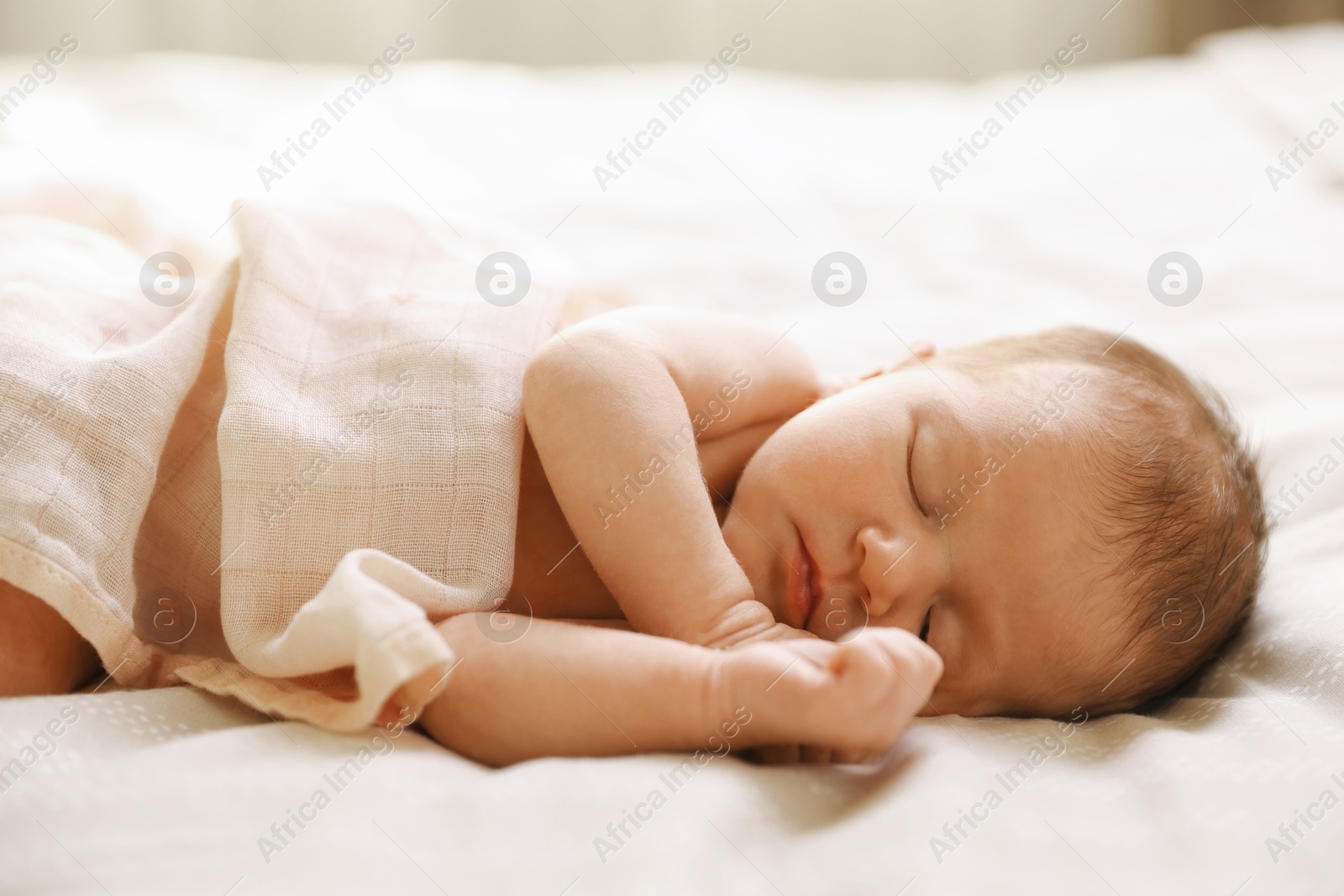 Bedtime. Cute little baby sleeping in bed indoors Photo of Bedtime. Cute little baby sleeping in bed indoors