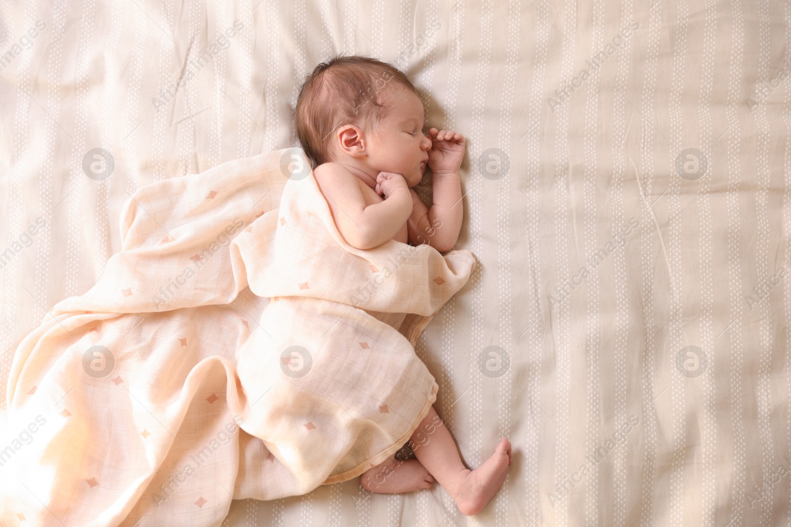 Bedtime. Cute little baby sleeping in bed indoors, top view Photo of Bedtime. Cute little baby sleeping in bed indoors, top view