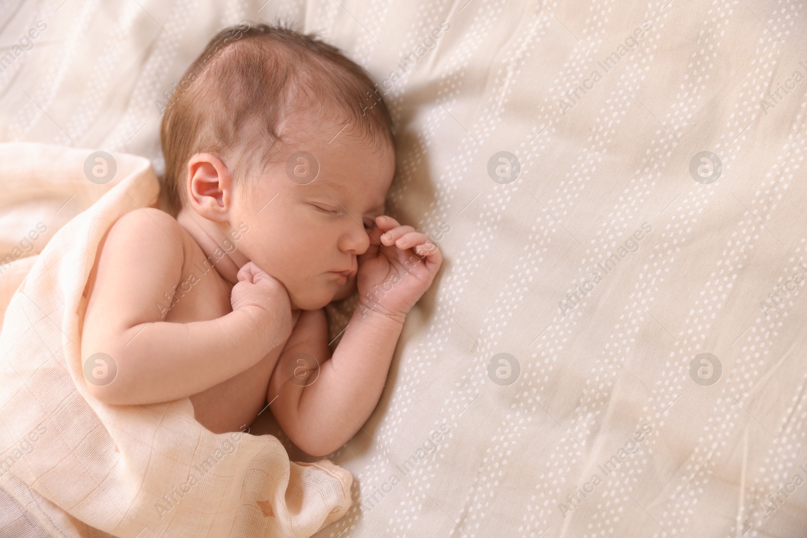 Bedtime. Cute little baby sleeping in bed indoors, top view. Space for text Photo of Bedtime. Cute little baby sleeping in bed indoors, top view. Space for text
