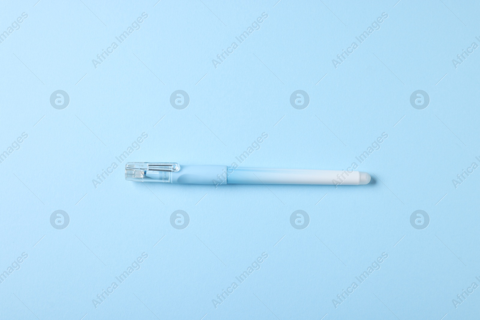 One stylish pen on light blue background, top view Photo of One stylish pen on light blue background, top view
