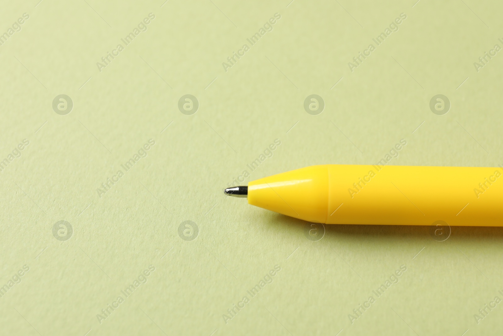 One stylish pen on green background, closeup. Space for text Photo of One stylish pen on green background, closeup. Space for text