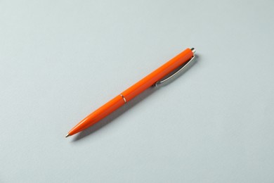 Photo of One stylish pen on grey background, above view
