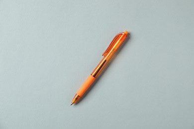 Photo of One stylish pen on grey background, top view