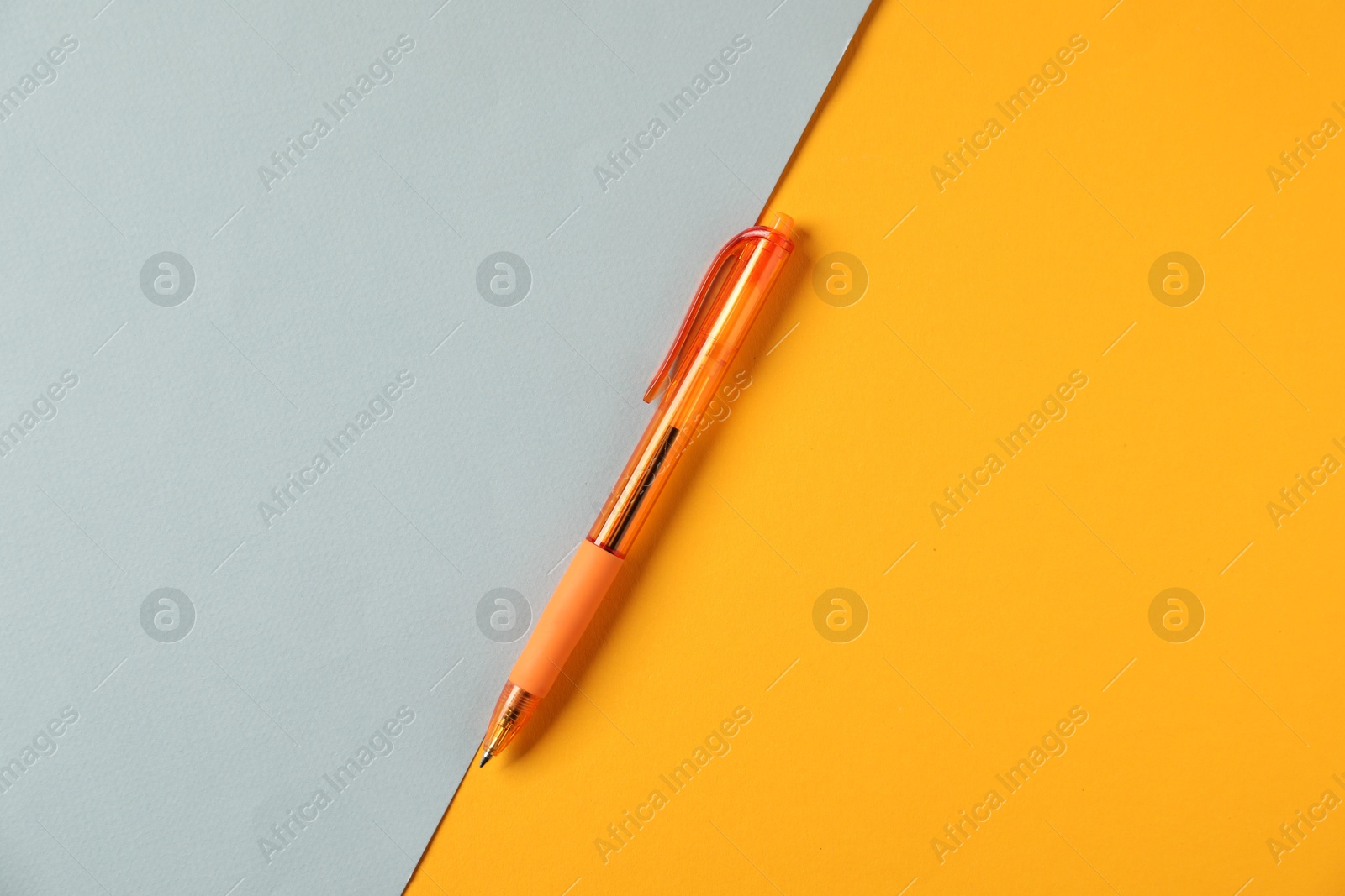 One stylish pen on color background, top view Photo of One stylish pen on color background, top view
