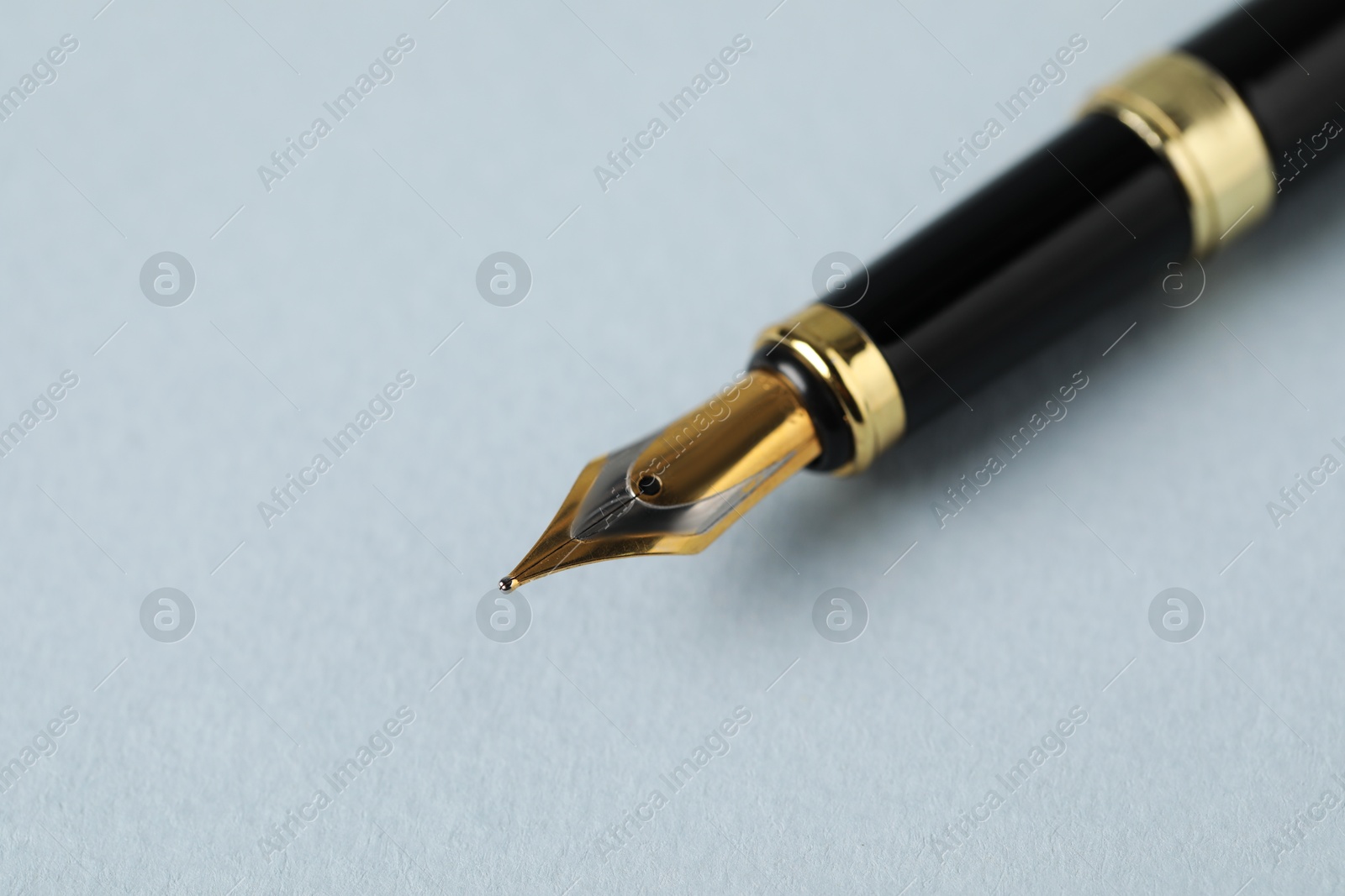 One fountain pen on grey background, macro view. Space for text Photo of One fountain pen on grey background, macro view. Space for text