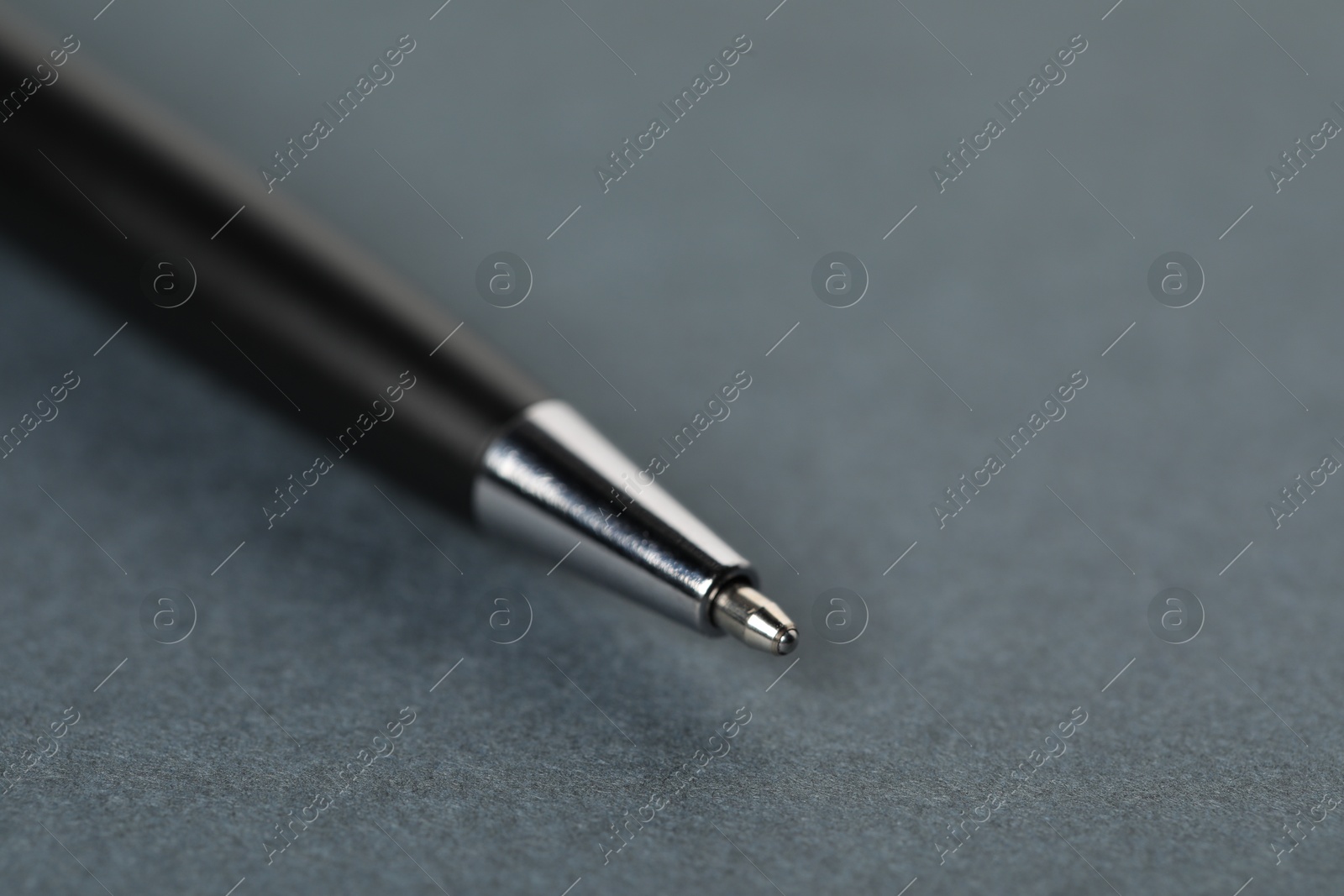 One stylish pen on grey background, macro view. Space for text Photo of One stylish pen on grey background, macro view. Space for text