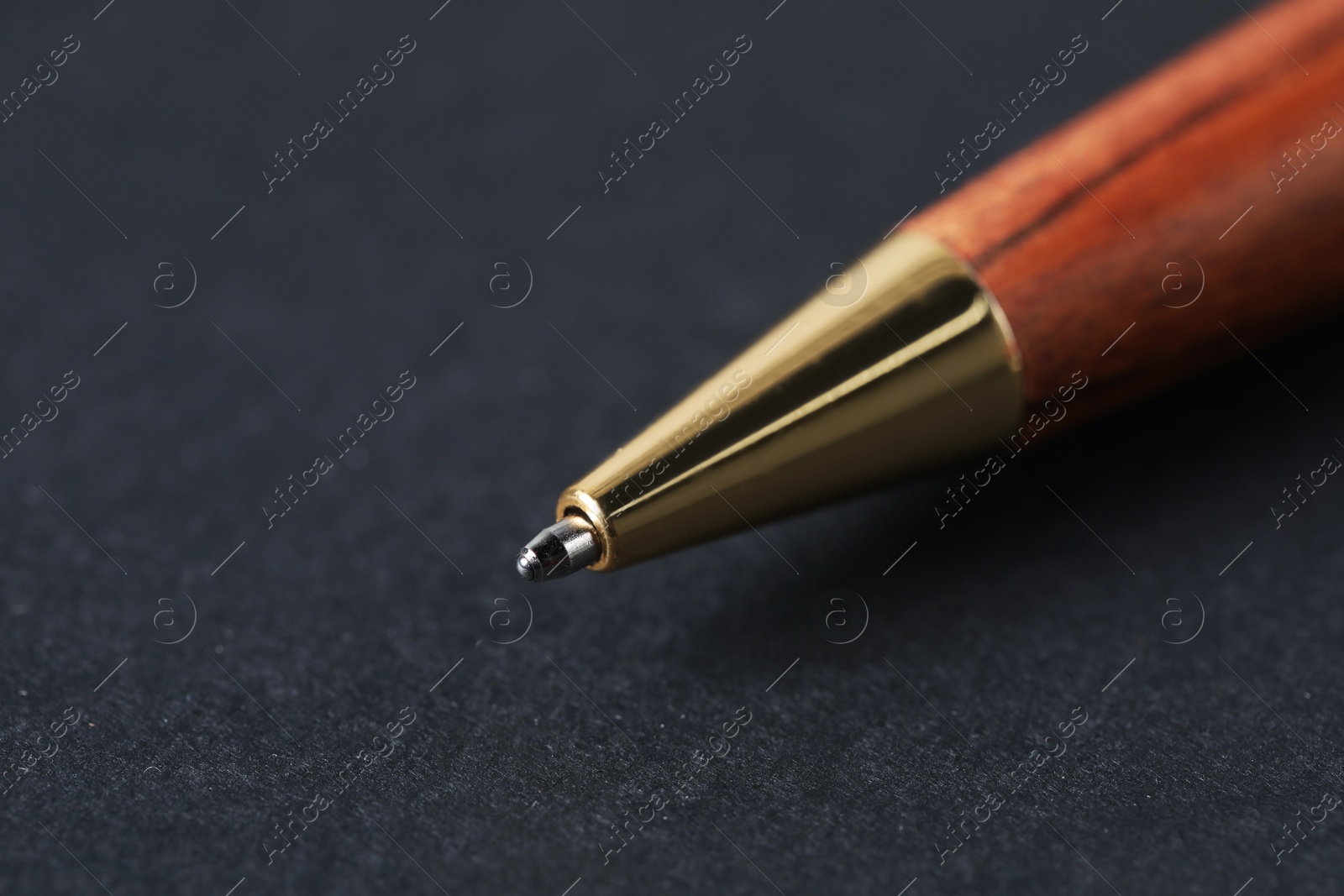 One stylish pen on black background, macro view. Space for text Photo of One stylish pen on black background, macro view. Space for text