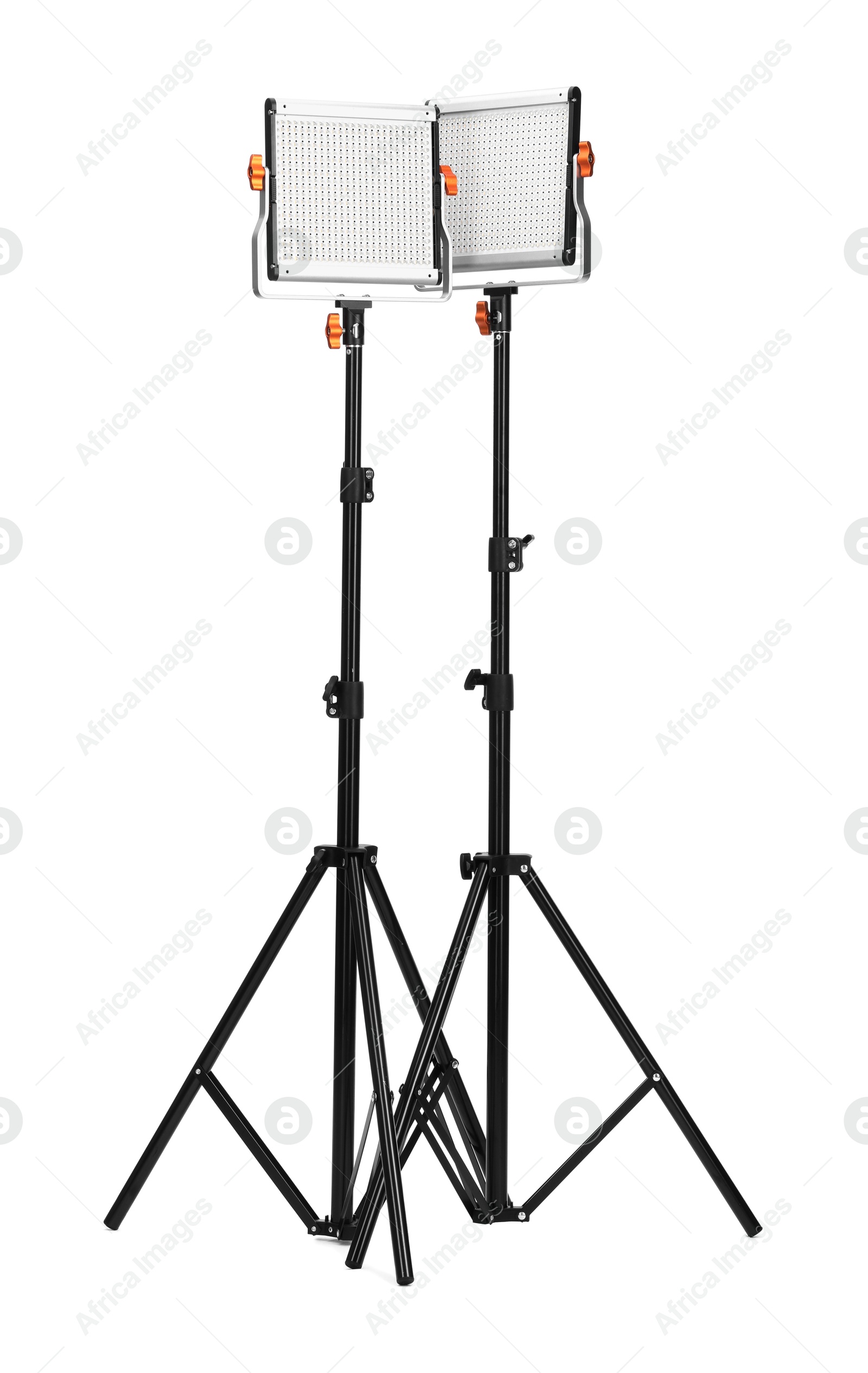 Professional lighting equipment with tripods isolated on white Photo of Professional lighting equipment with tripods isolated on white