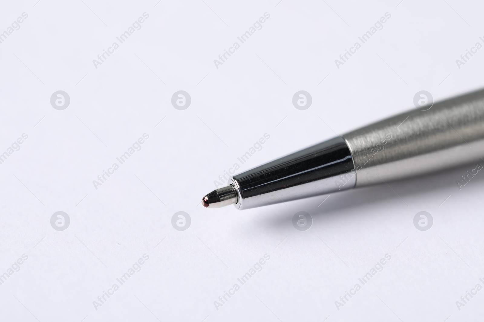 One stylish pen on light background, macro view. Space for text Photo of One stylish pen on light background, macro view. Space for text