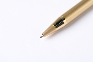 Photo of One stylish pen on light background, macro view. Space for text