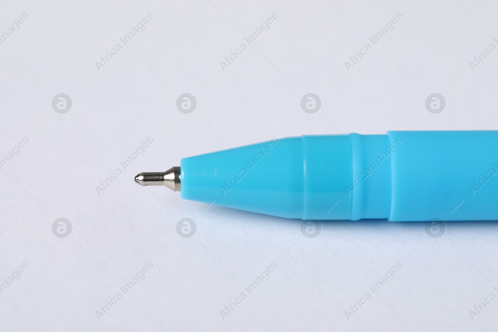 One stylish pen on light background, macro view. Space for text Photo of One stylish pen on light background, macro view. Space for text