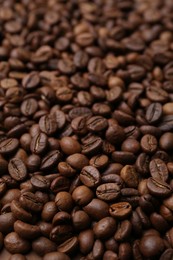 Photo of Pile of aromatic coffee beans as background, closeup