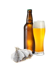 Image of Beer and dried cod fish fillets isolated on white