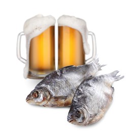 Image of Full mugs of beer and dried fish isolated on white