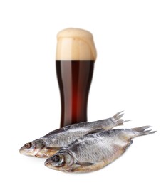 Image of Full glass of beer and dried fish on white background