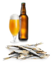 Image of Beer and dried smelt fish on white background, selective focus