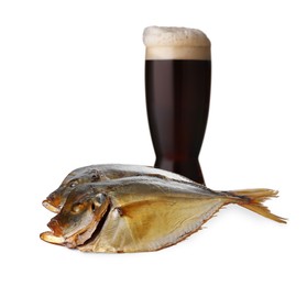 Image of Full glass of beer and dried fish on white background