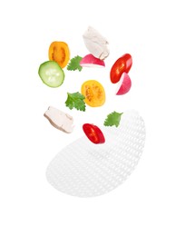 Image of Rice paper and different ingredients falling on white background