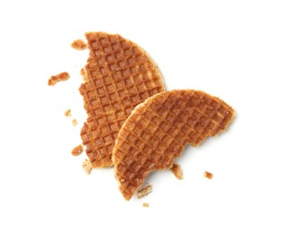 Photo of Pieces of tasty round waffle isolated on white, top view