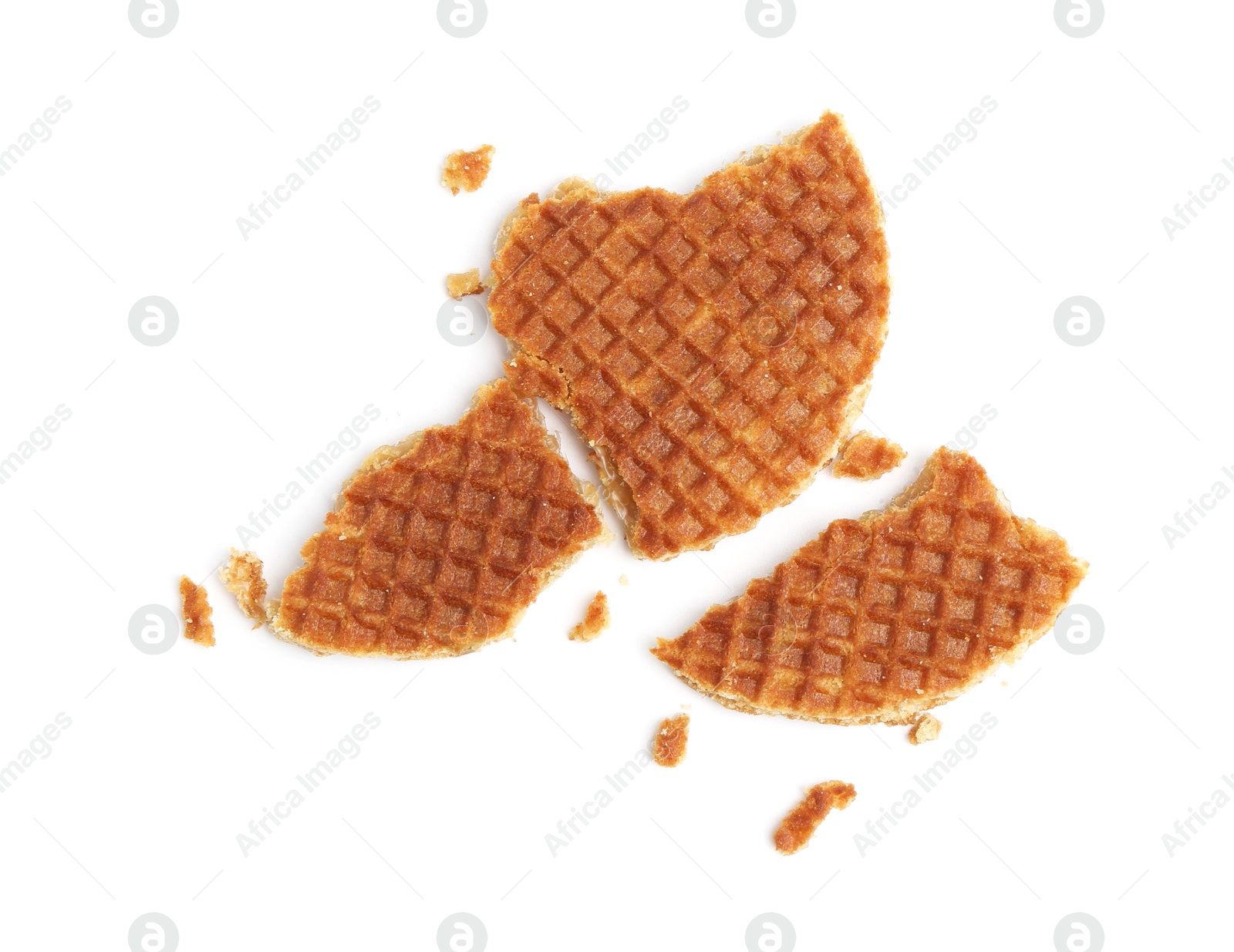 Pieces of tasty waffle isolated on white, top view Photo of Pieces of tasty waffle isolated on white, top view