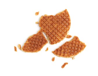 Photo of Pieces of tasty waffle isolated on white, top view
